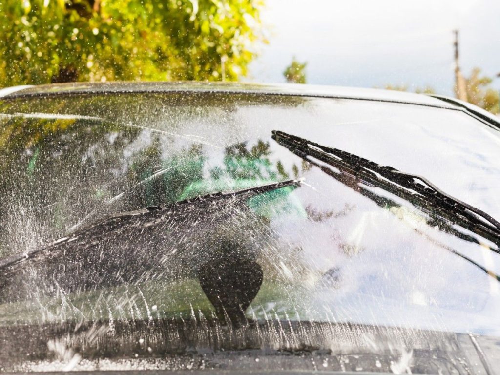 Affordable car wash Kelliwood Links, image of a car's front windshield being sprayed with water