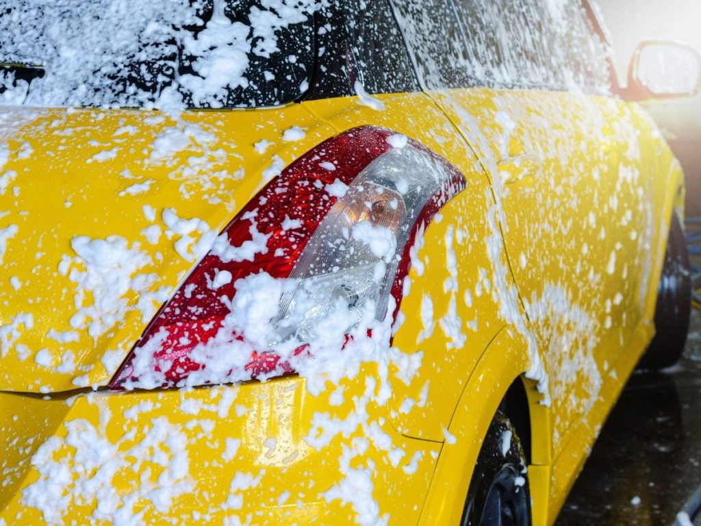 Best unlimited car wash in Cinco Ranch Equestrian Village, a vehicle being lathered with soap