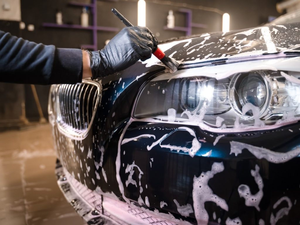 Unlimited Car Wash Membership Katy TX with a car being detailed with a brush