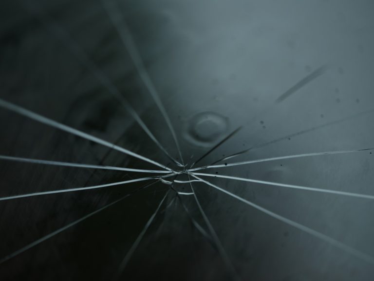 Cracked windshield with spider web fractures - car wash safety concerns for Katy TX unlimited membership holders