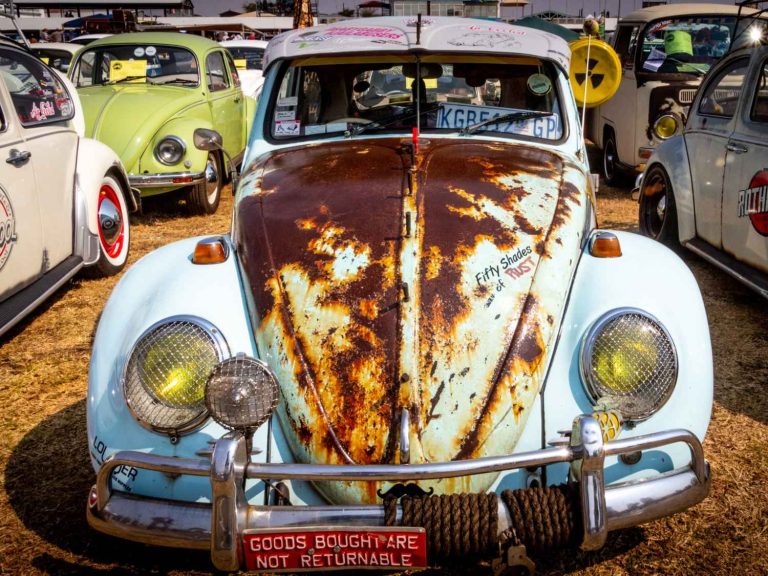 Dirty car with mud stains parked at Membership Car Wash Services Katy TX, highlighting neglect costs.