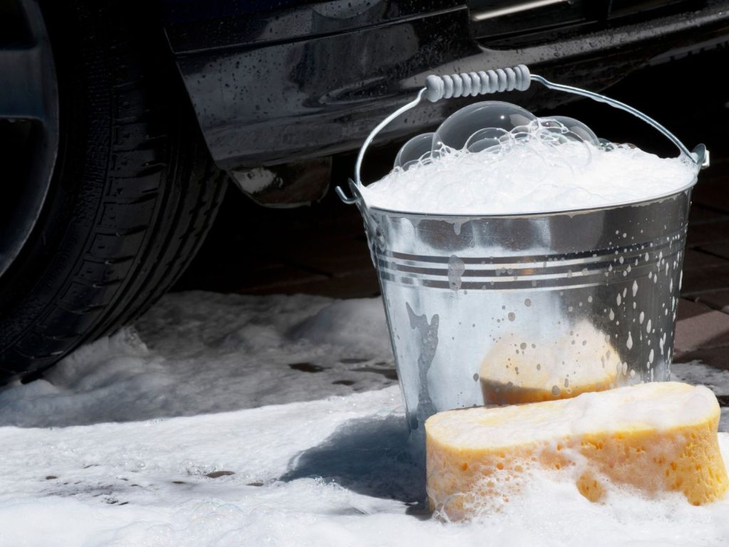 Soapy bucket and sponge for car cleaning at Best Car Wash in Katy TX.
